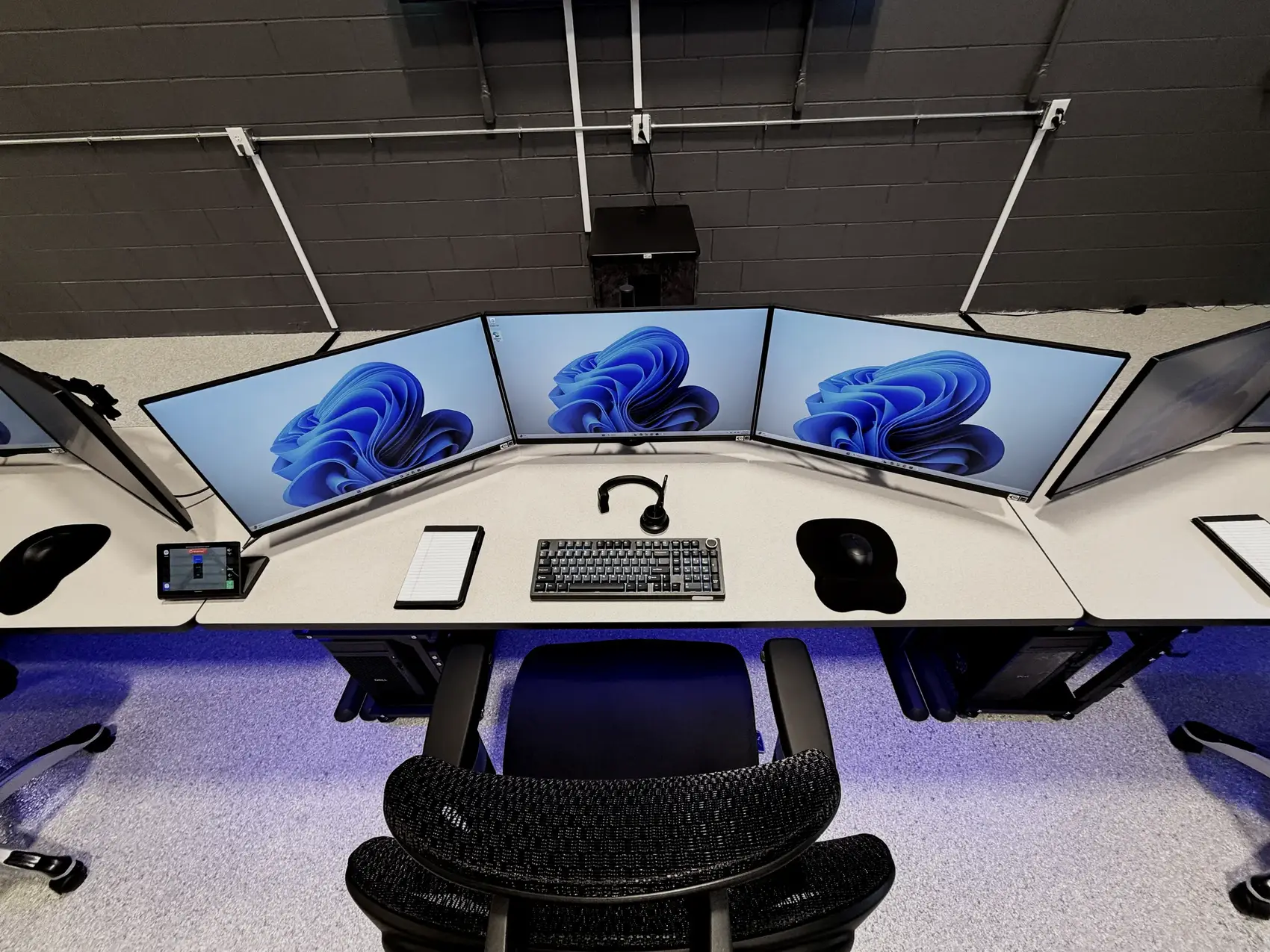 The OpSec Intel Global Security Operations Center watch floor in Atlanta, a curved console of monitors holding live situational awareness on shipments in transit.